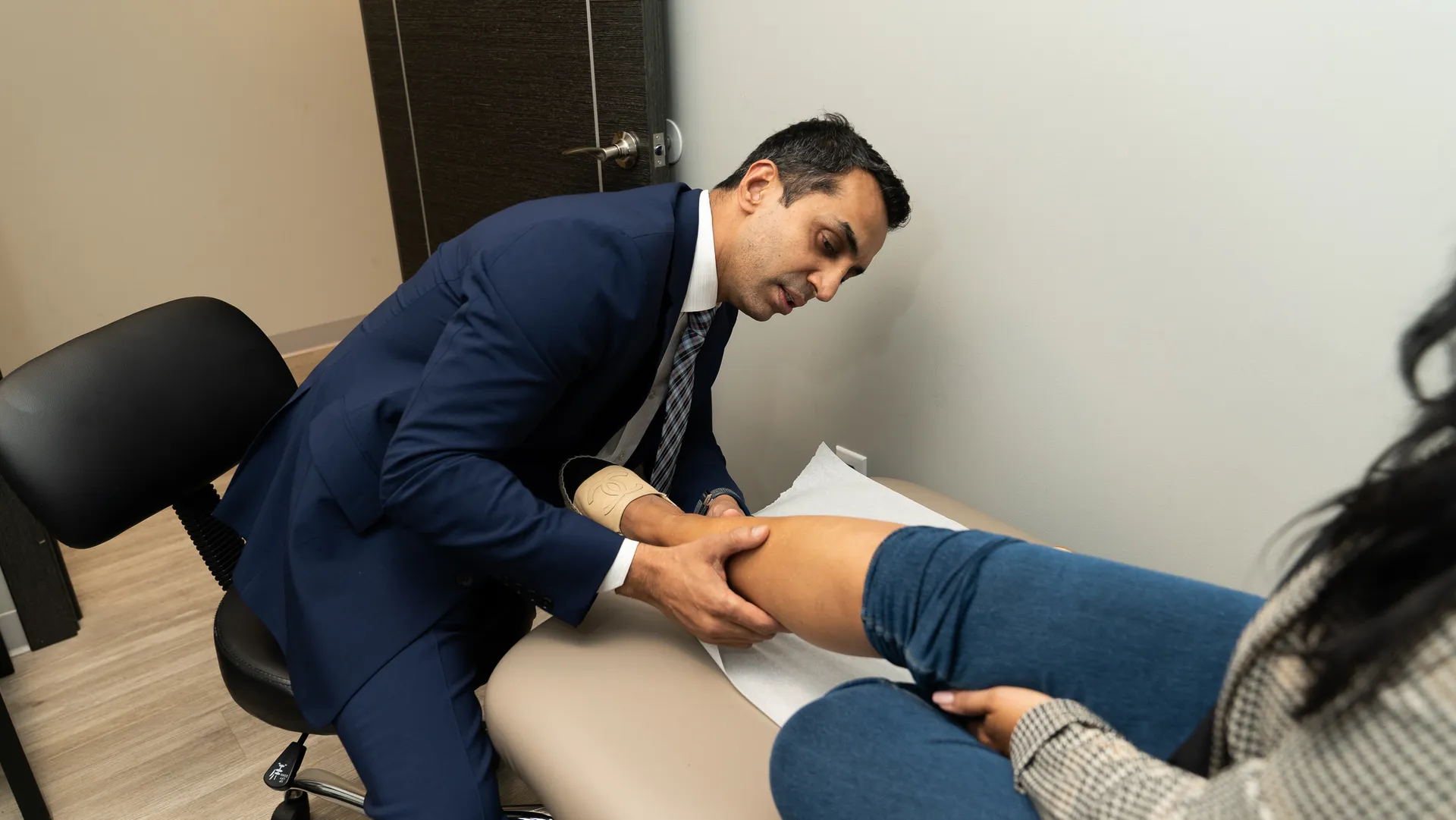 Dr. Sood consulting with patient